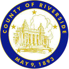 A blue and yellow county seal with stars on it.